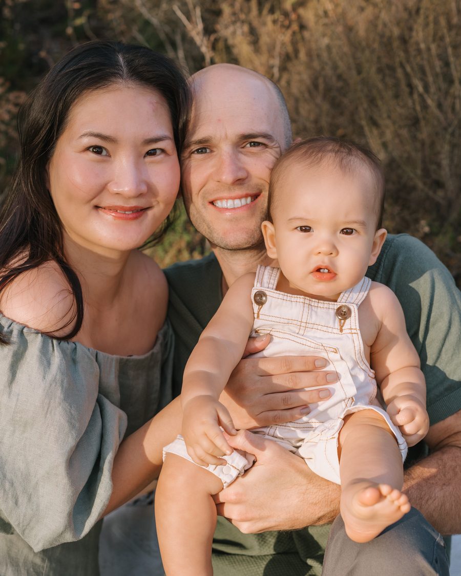 Tim with his wife and young son, outdoors in San Diego County